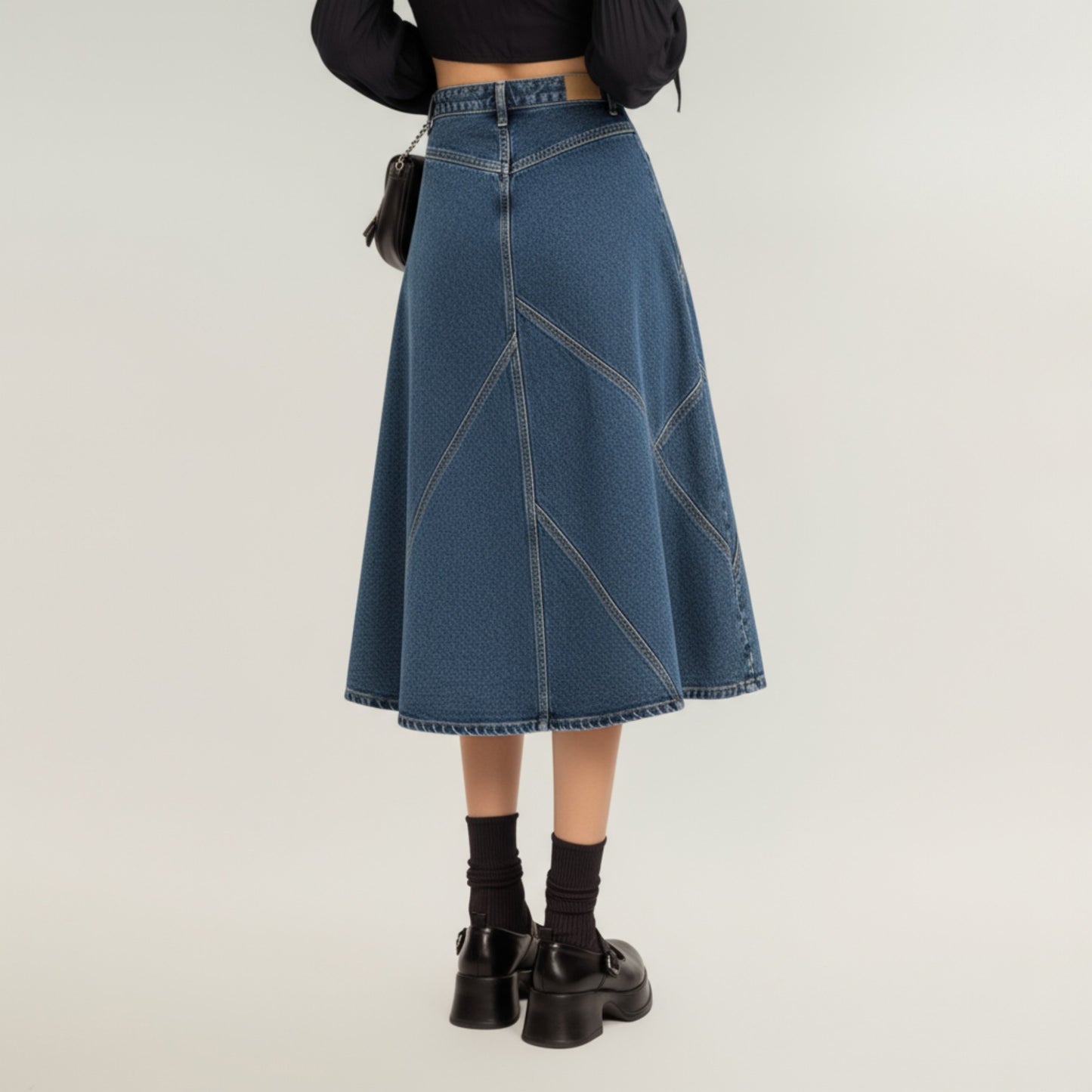 High Waist Denim Midi Skirt with Patchwork Seam Detailing and Flared Silhouette