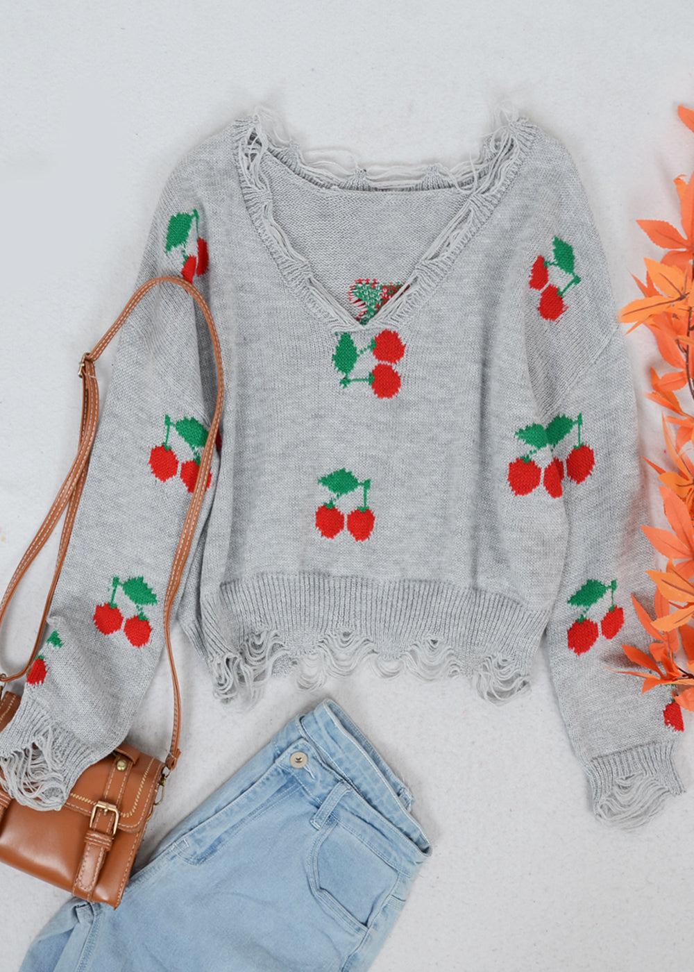 Tassel Frayed Hem Patterned Sweater