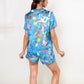 Whimsical Garden Animal Print Pajama Set with Short Sleeve Button-Up Top and Matching Shorts