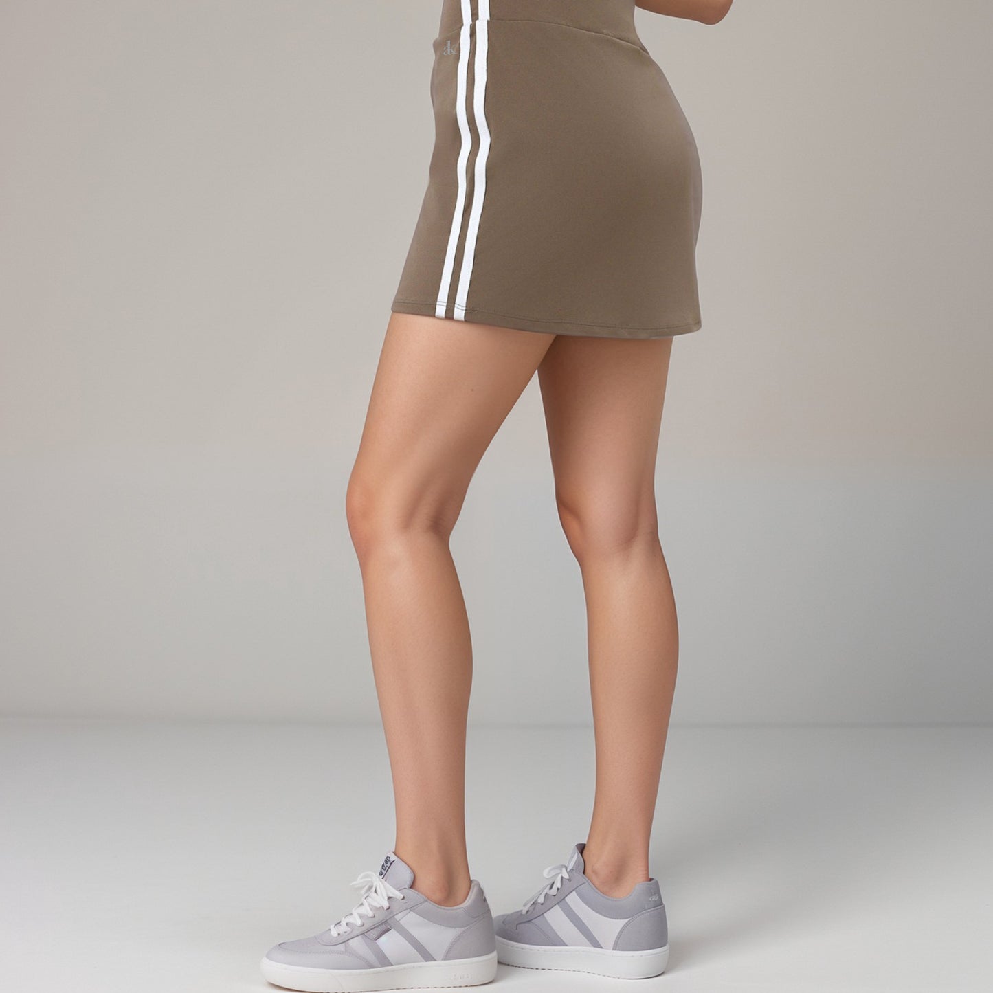 Active Women's Athletic Mini Skirt with Contrast Side Stripes and Built-In Shorts for Support