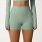 High Waist Active Shorts with Stretch Compression Fit Seamless Construction and Side Pocket Detail