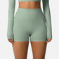 High Waist Active Shorts with Stretch Compression Fit Seamless Construction and Side Pocket Detail
