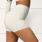 High Waist Active Shorts with Stretch Compression Fit Seamless Construction and Side Pocket Detail