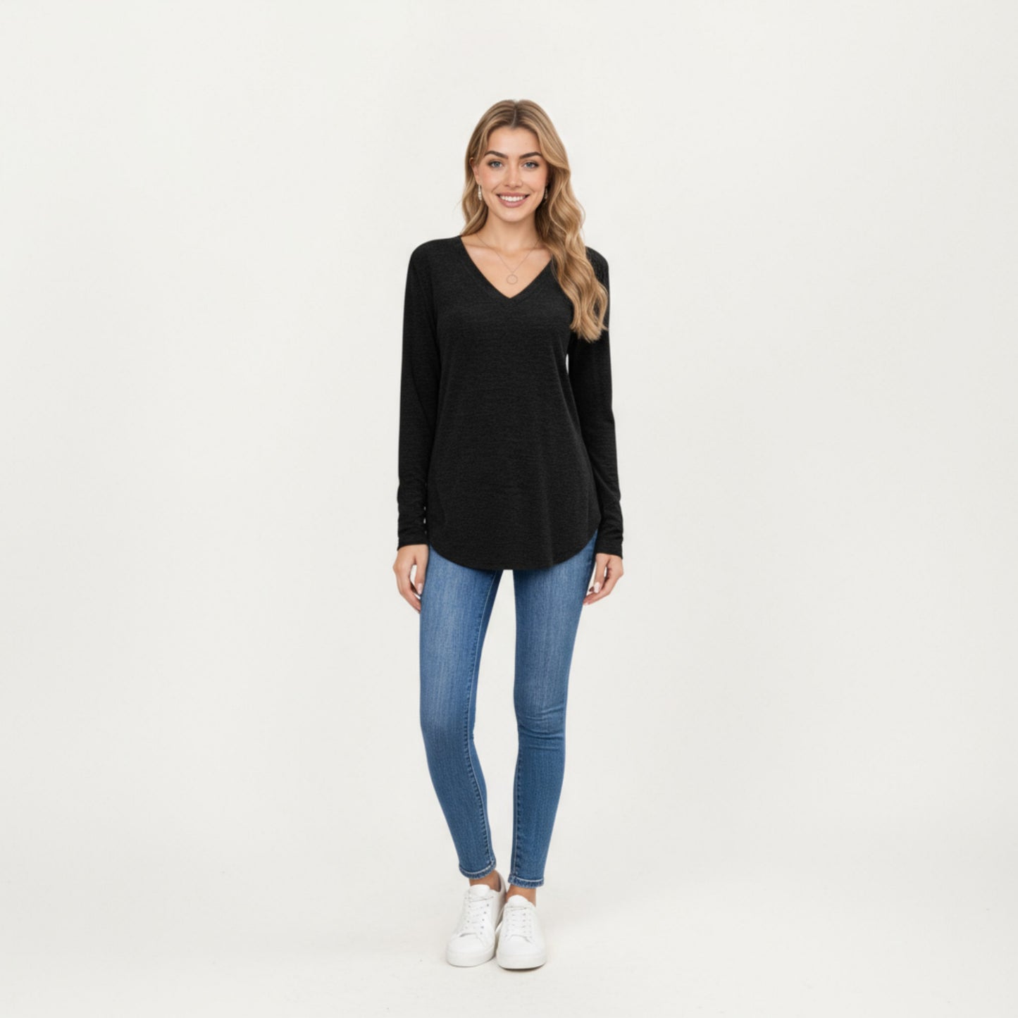 Long Sleeve V-Neck Knit Top with Curved Hem and Relaxed Fit