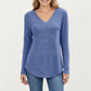 Long Sleeve V-Neck Knit Top with Curved Hem and Relaxed Fit