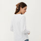 Long Sleeve Eyelet Embroidered Top with V-Neckline and Ruffle Cuffs