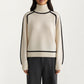 Turtleneck Pullover Top with Contrast Trim Details and Ribbed Hemline for a Clean Modern Silhouette