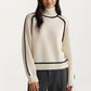 Turtleneck Pullover Top with Contrast Trim Details and Ribbed Hemline for a Clean Modern Silhouette