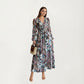 Long Sleeve Maxi Dress with V-Neckline, Ruched Elastic Waist Detail, and Flowing Sheer Overlay Featuring an Allover Floral Pattern