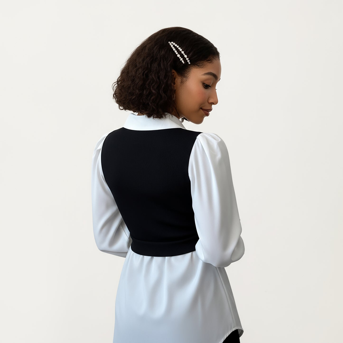 Layered Contrast Blouse with Structured Collar, Fitted Knit Bodice and Flowing Buttoned Hem Design