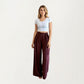 Wide Leg Pants with Draped Front Panels and Soft Flowing Fabric Featuring a Tie Waist Detail and Smooth Relaxed Silhouette