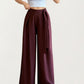 Wide Leg Pants with Draped Front Panels and Soft Flowing Fabric Featuring a Tie Waist Detail and Smooth Relaxed Silhouette