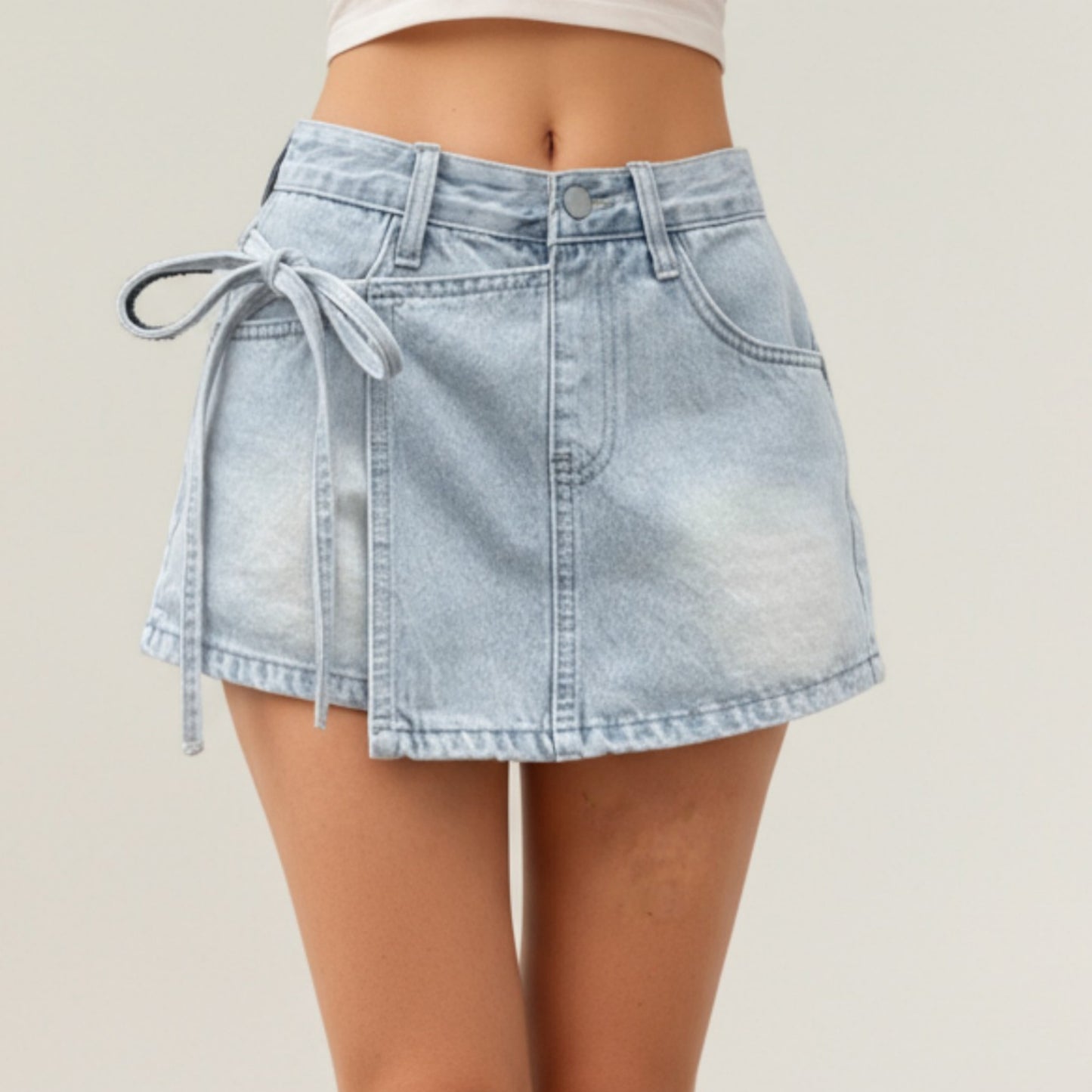 Denim Mini Skirt with Front Seam Detailing, Adjustable Side Tie Accent and Structured Fabric for a Smooth, Flattering Shape