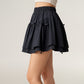 Tiered Mini Skirt with Layered Ruffle Hem and Delicate Bow Accents in Soft Lightweight Fabric