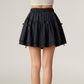 Tiered Mini Skirt with Layered Ruffle Hem and Delicate Bow Accents in Soft Lightweight Fabric
