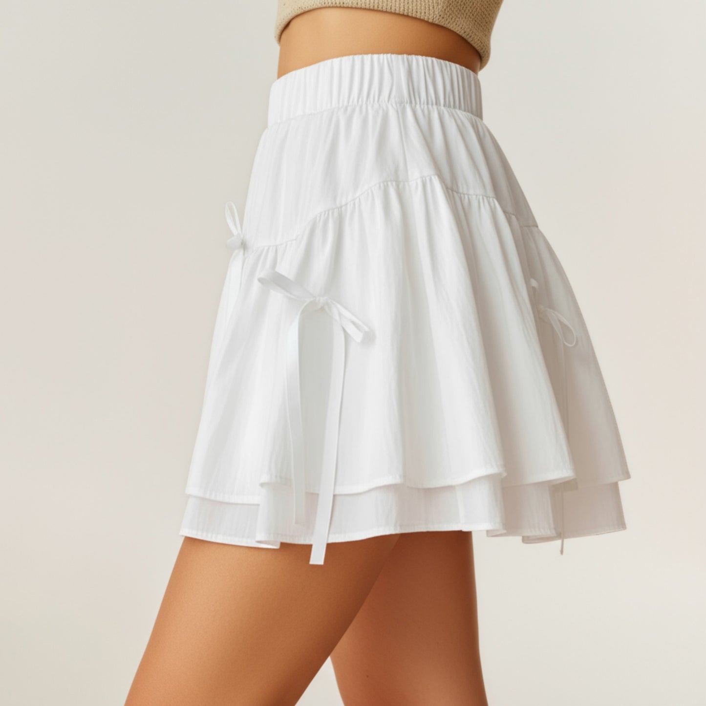 Tiered Mini Skirt with Layered Ruffle Hem and Delicate Bow Accents in Soft Lightweight Fabric