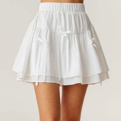 Tiered Mini Skirt with Layered Ruffle Hem and Delicate Bow Accents in Soft Lightweight Fabric