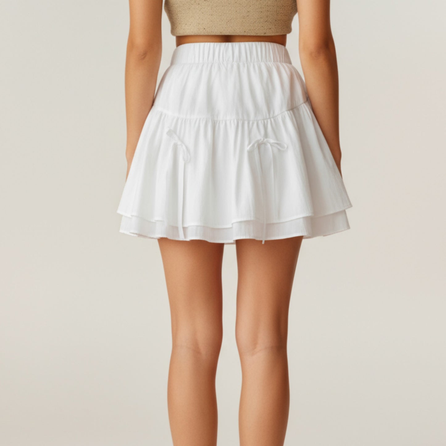 Tiered Mini Skirt with Layered Ruffle Hem and Delicate Bow Accents in Soft Lightweight Fabric