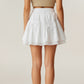 Tiered Mini Skirt with Layered Ruffle Hem and Delicate Bow Accents in Soft Lightweight Fabric