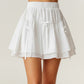 Tiered Mini Skirt with Layered Ruffle Hem and Delicate Bow Accents in Soft Lightweight Fabric