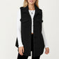 Faux Shearling Button Front Vest with Collared Neckline, Chest Flap Pockets, and Longline Fit