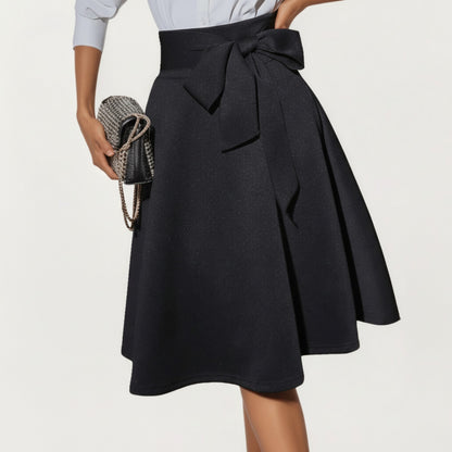 Flared Midi Skirt with Structured High Waist and Oversized Bow Detail Creating a Smooth Draped Silhouette