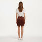 Button Front Corduroy Mini Skirt with Structured Patch Pockets and Clean Straight Hem for a Modern Textured Look