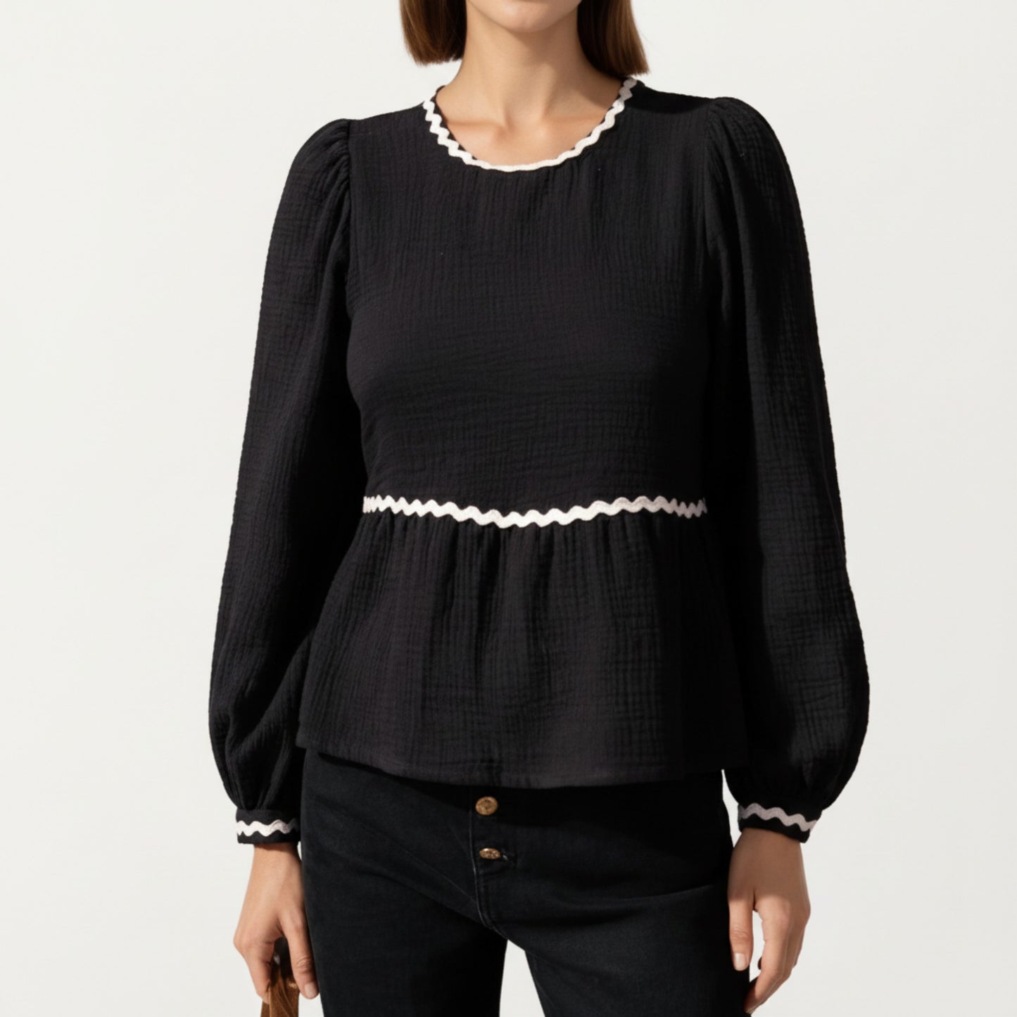 Long Sleeve Textured Peplum Top with Contrast Trim Accents and Statement Bow Detail