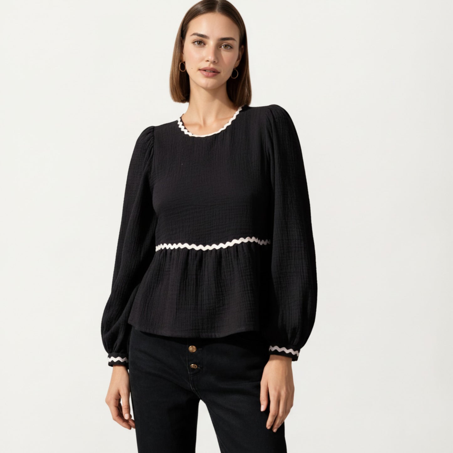 Long Sleeve Textured Peplum Top with Contrast Trim Accents and Statement Bow Detail