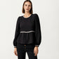 Long Sleeve Textured Peplum Top with Contrast Trim Accents and Statement Bow Detail
