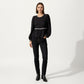 Long Sleeve Textured Peplum Top with Contrast Trim Accents and Statement Bow Detail
