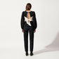 Long Sleeve Textured Peplum Top with Contrast Trim Accents and Statement Bow Detail