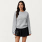 Long Sleeve Knit Top with Dimensional Ribbon Design and Soft Textured Fabric for Stylish Everyday Wear