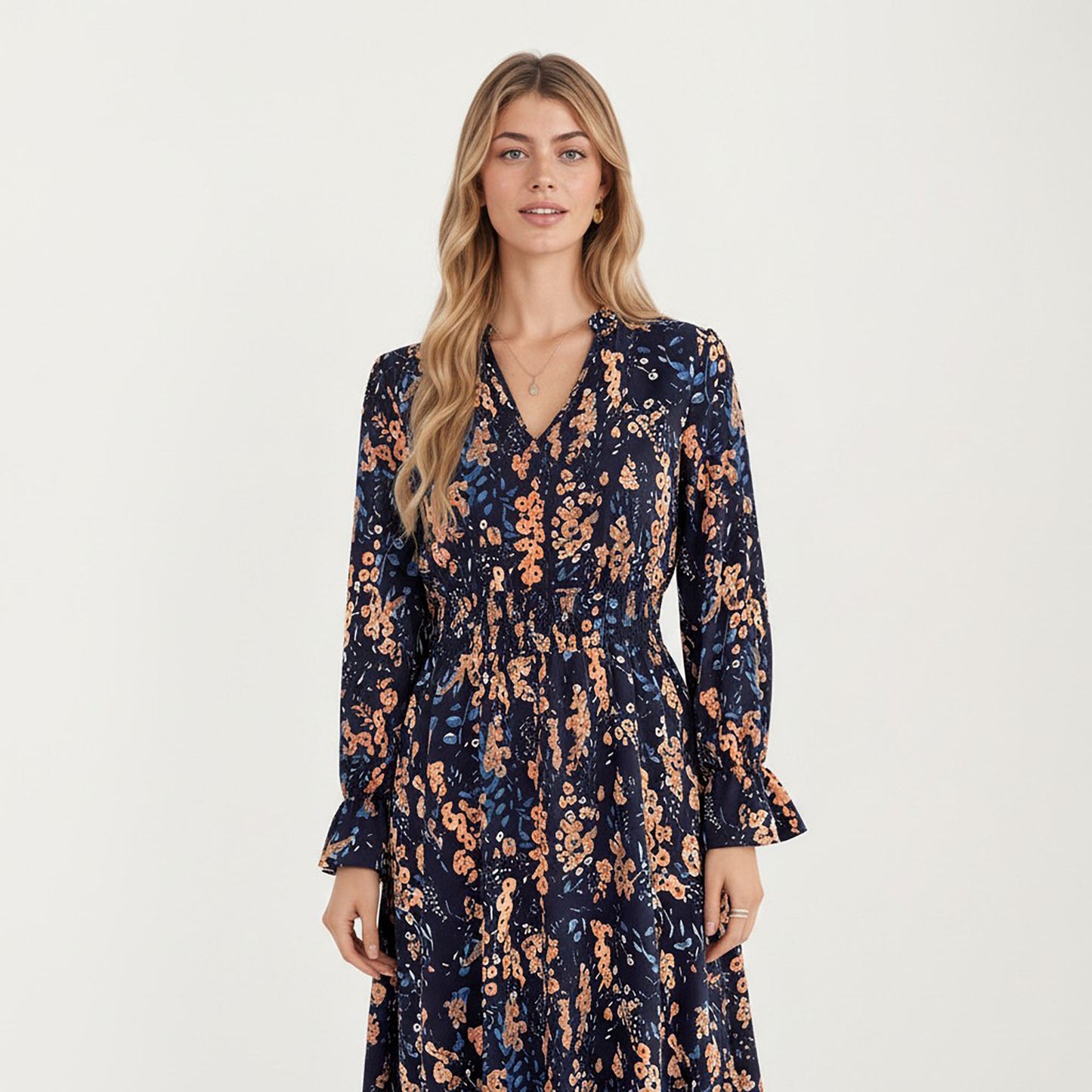 Floral Print Smocked Waist Dress with Long Sleeves, V-Neckline, and Ruffled Hem for a Feminine and Flattering Fit