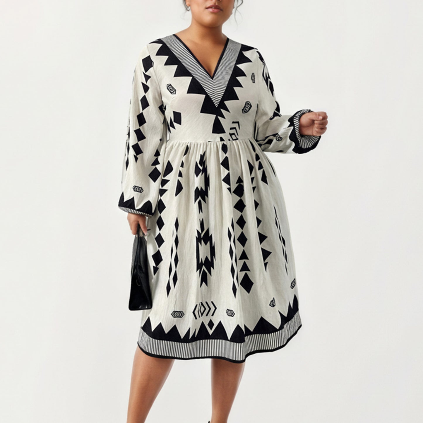 Plus Size Long Sleeve V Neck Dress with Geometric Print Border Details and Flowy Skirt