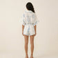 Short Sleeve Printed Romper with Collared Neckline Button Front Closure Waist Tie Relaxed Fit