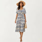 Short Sleeve Printed Midi Dress with V Neckline Drawstring Waist and Tiered Flowy Silhouette Design
