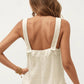 Sleeveless Textured Romper with Wide Straps Button Front Detail and Relaxed Fit Lightweight Design