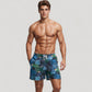 Men's Tropical Leaf Print Swim Trunks with Quick-Dry Fabric and Drawstring Waistband for Beach and Pool Comfort