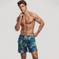 Men's Tropical Leaf Print Swim Trunks with Quick-Dry Fabric and Drawstring Waistband for Beach and Pool Comfort