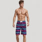 Men's Vibrant Stripe Swim Trunks with Wave-Inspired Pattern and Drawstring Waistband in Quick-Dry Fabric