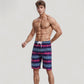 Men's Vibrant Stripe Swim Trunks with Wave-Inspired Pattern and Drawstring Waistband in Quick-Dry Fabric