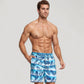 Men's Tropical Leaf Print Swim Trunks with Adjustable Drawstring Waist and Quick-Dry Striped Fabric