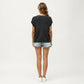 Short Sleeve Knit Top with Floral Eyelet Pattern and Ribbed Crew Neck