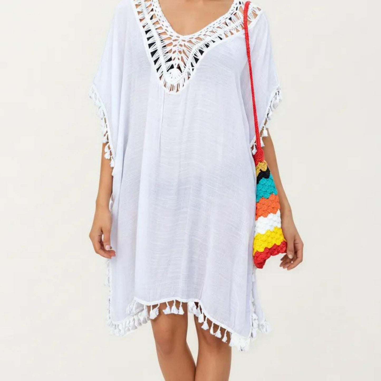 Sheer Crochet V Neck Swim Cover Up Poncho with Tassel Trim and Flowy Silhouette