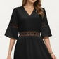 V Neck Midi Dress with Lace Trim Paneling and Short Wide Sleeves Flowing Silhouette