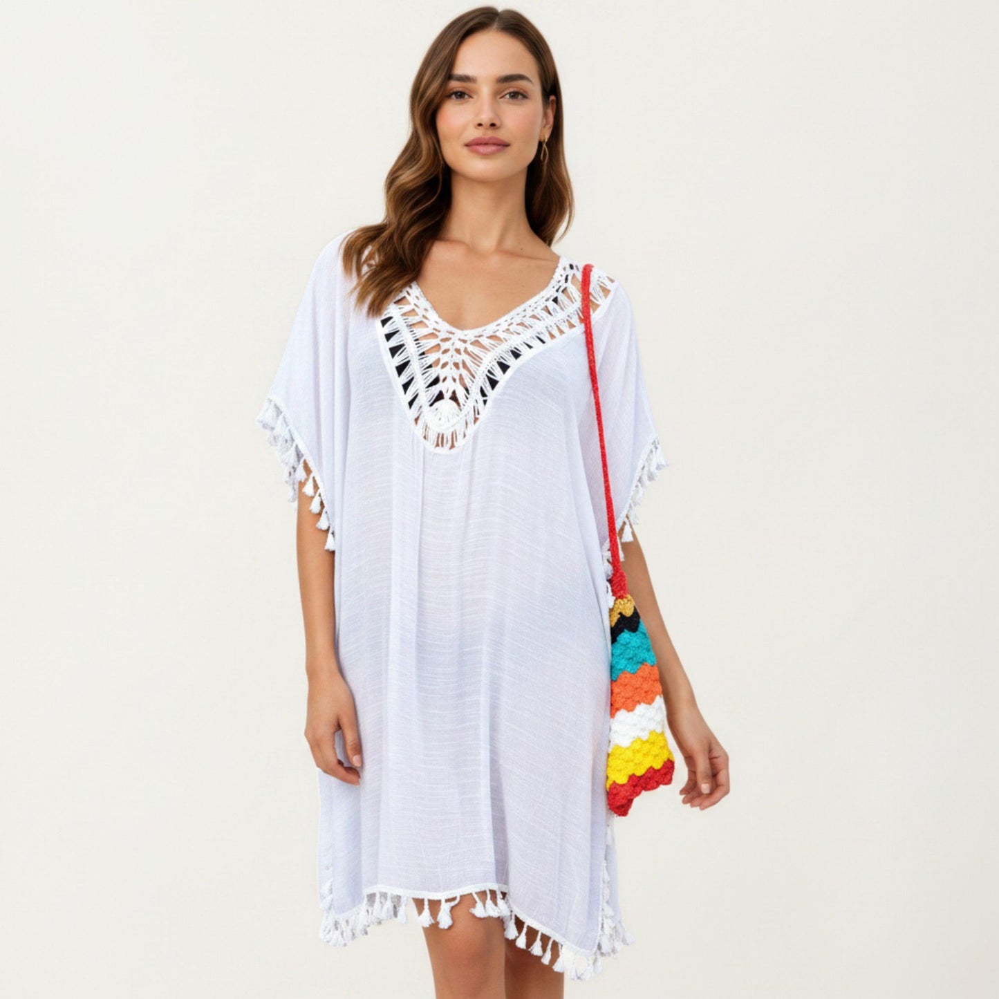 Sheer Crochet V Neck Swim Cover Up Poncho with Tassel Trim and Flowy Silhouette
