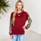 Crisscross V-Neck Top with Leopard Print Sleeves