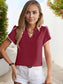 Anna-Kaci Women's V-Neck Short Sleeve Top with Pom Pom Trim and Split Hem Detail