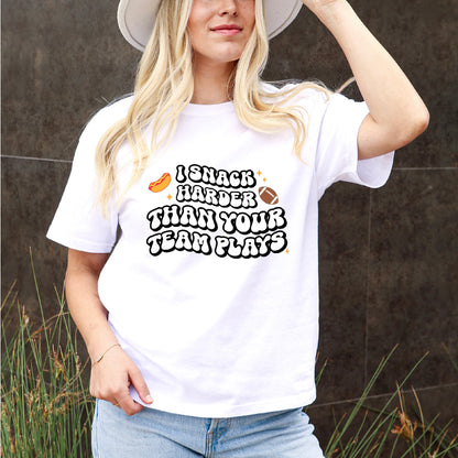 American Football Trendsetter Tee: "I Snack Harder Than Your Team Plays" In Black